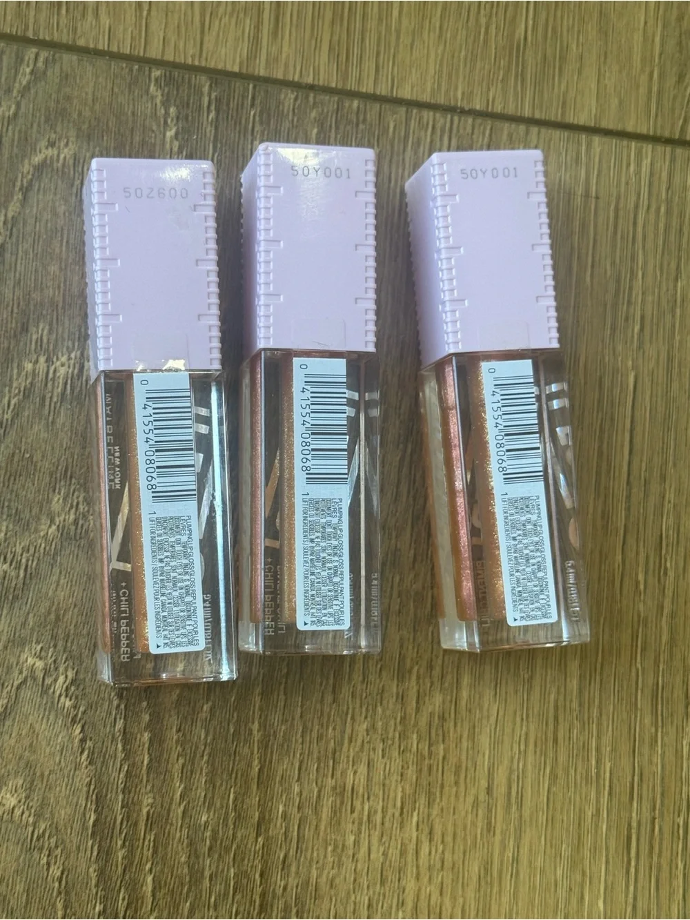 MAYBELLINE Lilac-Top Glossy Lip Plump Trio - Shimmery Peachy Gold.
